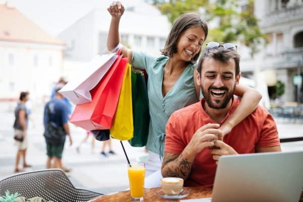 Loving couple having fun at a restaurant. Shopping, date, work, happy people concept.